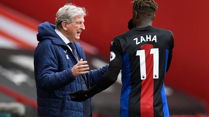 Roy Hodgson and Wilfried Zaha have helped steer Crystal Palace to top flight safety again. Photograph: Peter Powell/Getty/AFP