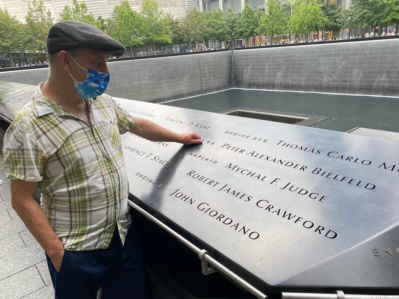 Brendan Fay beside Fr Mychal Judge’s entry on the Ground Zero memorial. Photograph: Eli Moulton