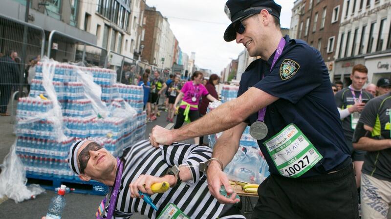 Nigel Waters (aka the Robber) and Alan Connors (aka the Detective) who ran handcuffed in the Bon Secours Hospital Great Limerick Run. Photograph: Brian Gavin Press 22