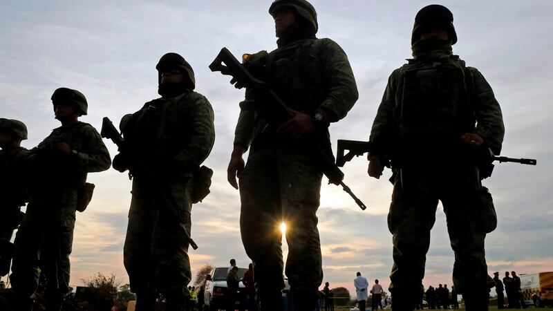 Soldiers stand guard at the site of a massive blaze triggered by a leaky pipeline in Tlahuelilpan, Hidalgo state, Mexico. Photograph: Alfredo Estrella/AFP/Getty Images