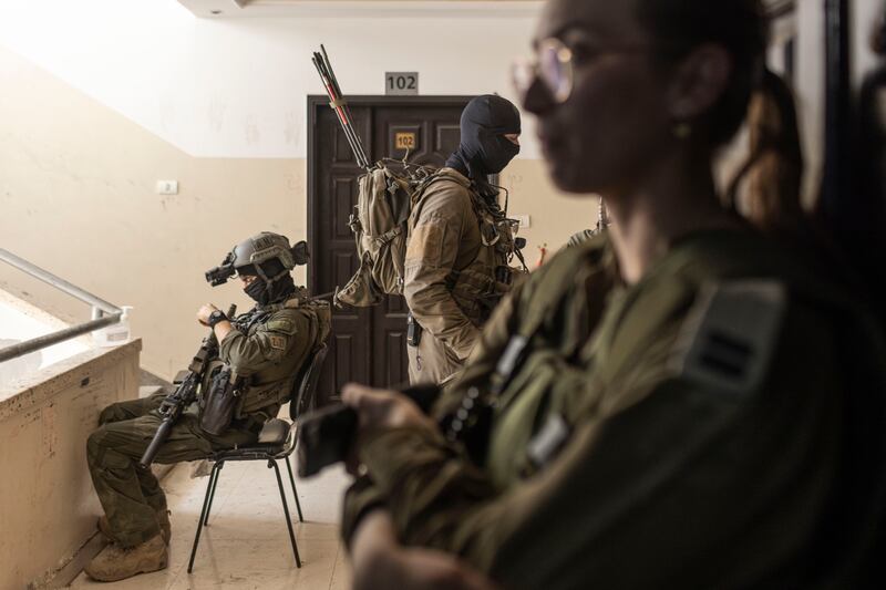 Israeli soldiers from Flotilla 13, a commando unit, in a private clinic outside Shifa Hospital in Gaza City. Photograph: Avishag Shaar-Yashuv/New York Times
                      
