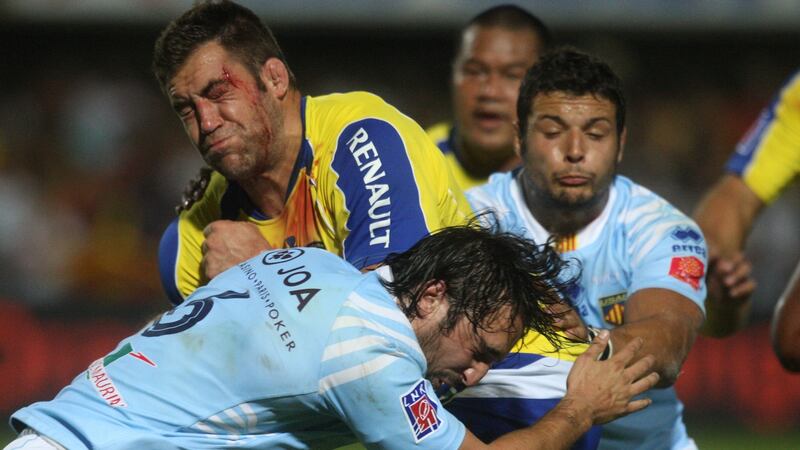 Clermont’s Jamie Cudmore is tackled by Perpignan’s Bertrand Guiry during a  French Top 14  match at the Aime-Giral stadium in Perpignan in 2010. Photograph: Raymond Roig/AFP via Getty Images