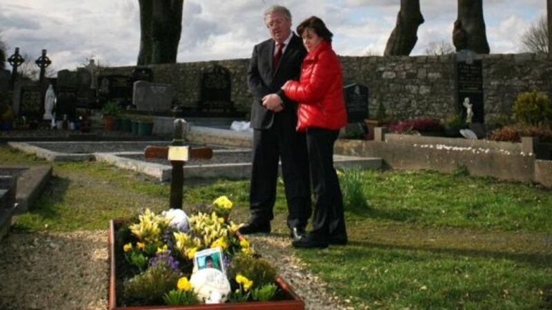 Andrew Dolan’s parents, Joe and Rosie, pictured in 2014 at his graveside in Ardcarne Cemetery , Co Roscommon. Photograph: Brian Farrell