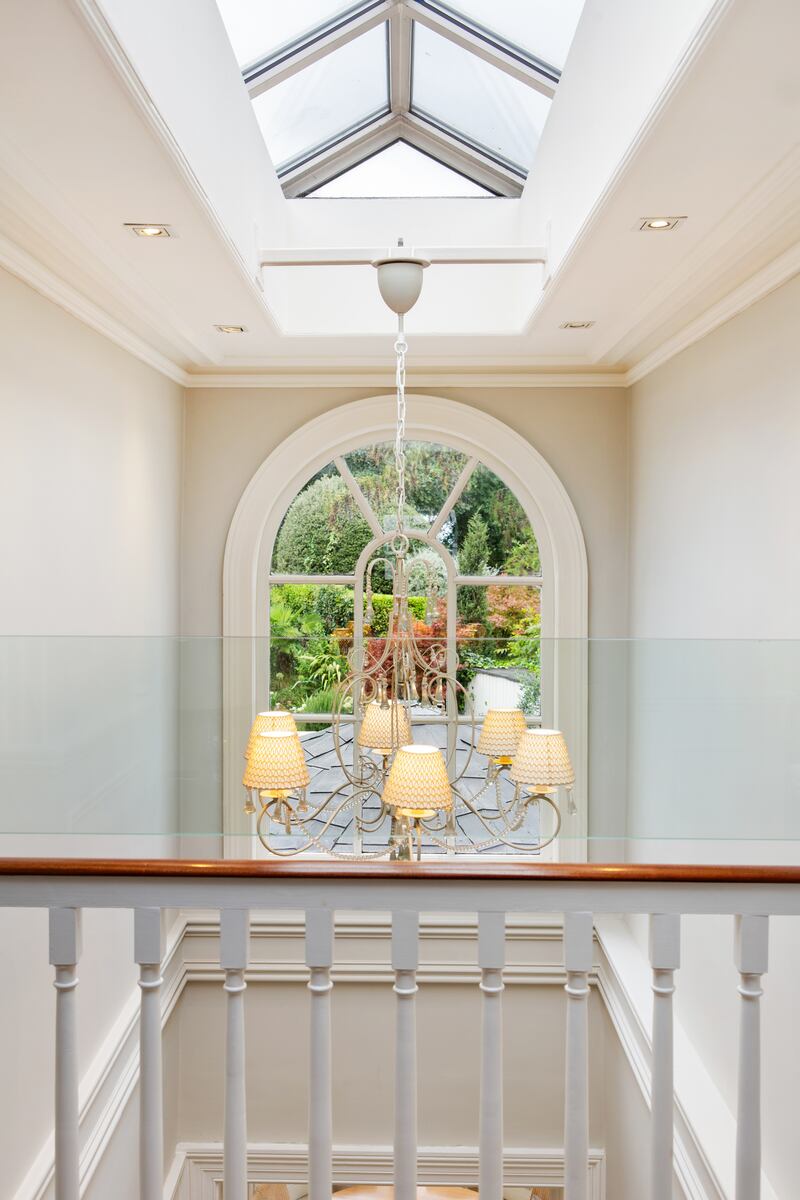 An atrium style roof light brings lots of light into the house