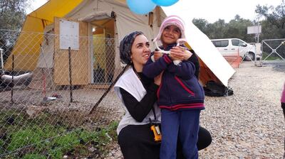Myriam Abdel-Basit with one of the children at Moria refugee camp in Greece: Photograph courtesy Médecins Sans Frontières.