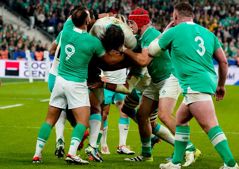 South Africa’s Eben Etzebeth is held up by Josh van der Flier and Jamison Gibson Park of Ireland. Photograph: Dave Winter/Inpho 
