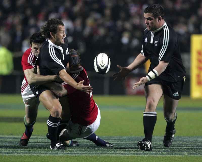 Maori's Carlos Spencer off loads a pass to Corey Flynn during the 2005 British and Irish Lions tour. Photograph: Michael Bradley/Inpho