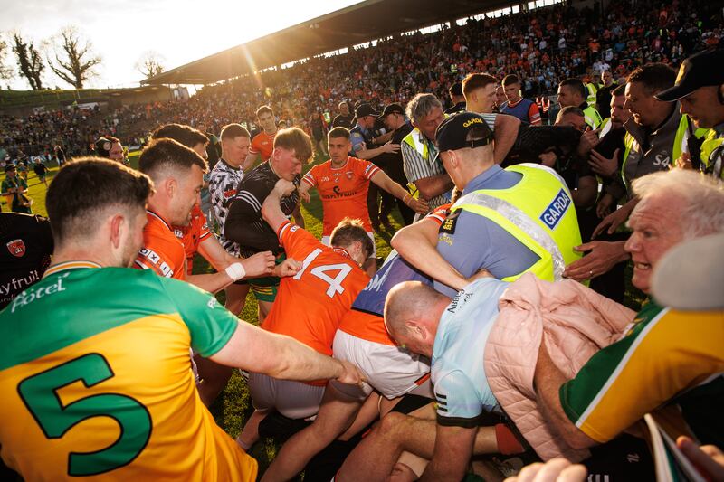 Tempers flare between the two teams after the final whistle as fans and members of An Garda Síochána converge. Photograph: Ben Brady/Inpho
