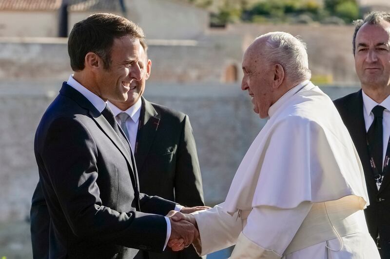 Pope Francis is welcomed by French president Emmanuel Macron as he arrives at the final session of the Rencontres Mediterraneennes meeting at the Palais du Pharo in Marseille. Photograph: Alessandra Tarantino/AP