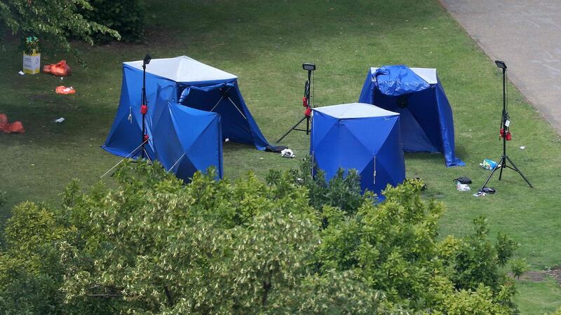 Police tents and equipment at the scene of a fatal stabbing incident in which three people died and which is being treated as terrorism, in Forbury Gardens park, Reading, west of London. Photograph: AFP/Getty