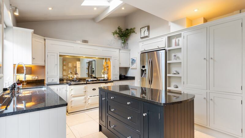 The kitchen features an Aga and an island.