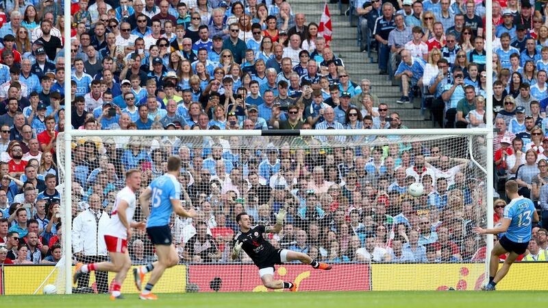 Paul Mannion scores a first half penalty against Tyrone. Photograph: James Crombie/Inpho