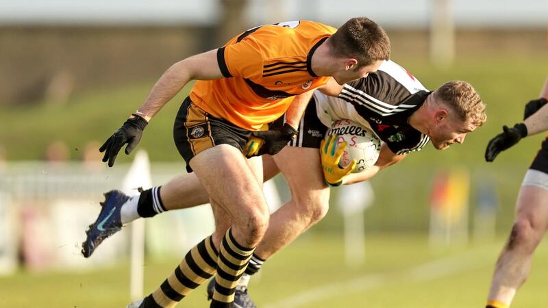 Sean Quilter of  Austin Stacks challenges Newcastle West’s Brian O’Sullivan during the AIB Munster Club SFC semi-final  at Austin Stack Park in Tralee. Photograph: Laszlo Geczo/Inpho