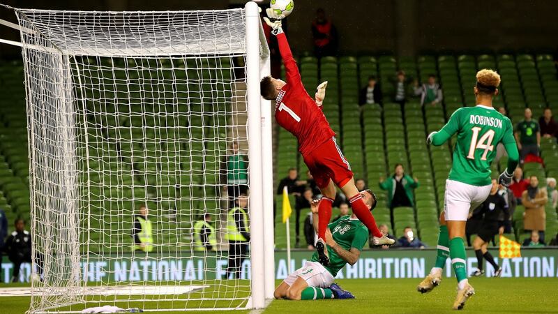 Northern Ireland’s Bailey Peacock-Farrell saves a header from Shane Duffy. Photograph: Ryan Byrne/Inpho