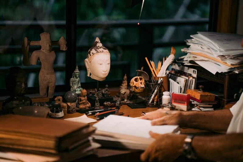 Momentos of Theroux’s travels litter his writing desk. Photograph: Michelle Mishina Kunz/The New York Times