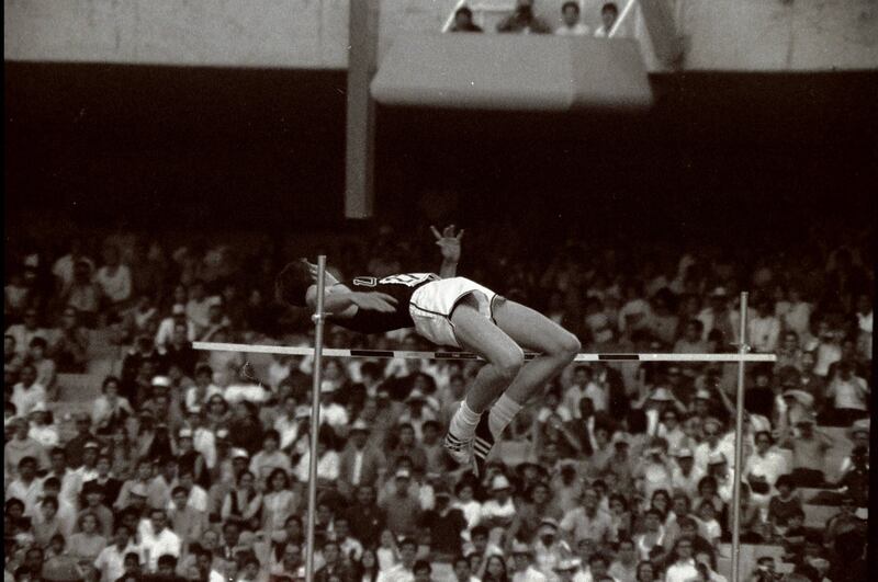 Dick Fosbury of the USA clears the bar in the high jump with his dramatic new jumping style on his way to victory in the1968 Olympics. It became knows as the Fosbury Flop. Tony Duffy /Allsport