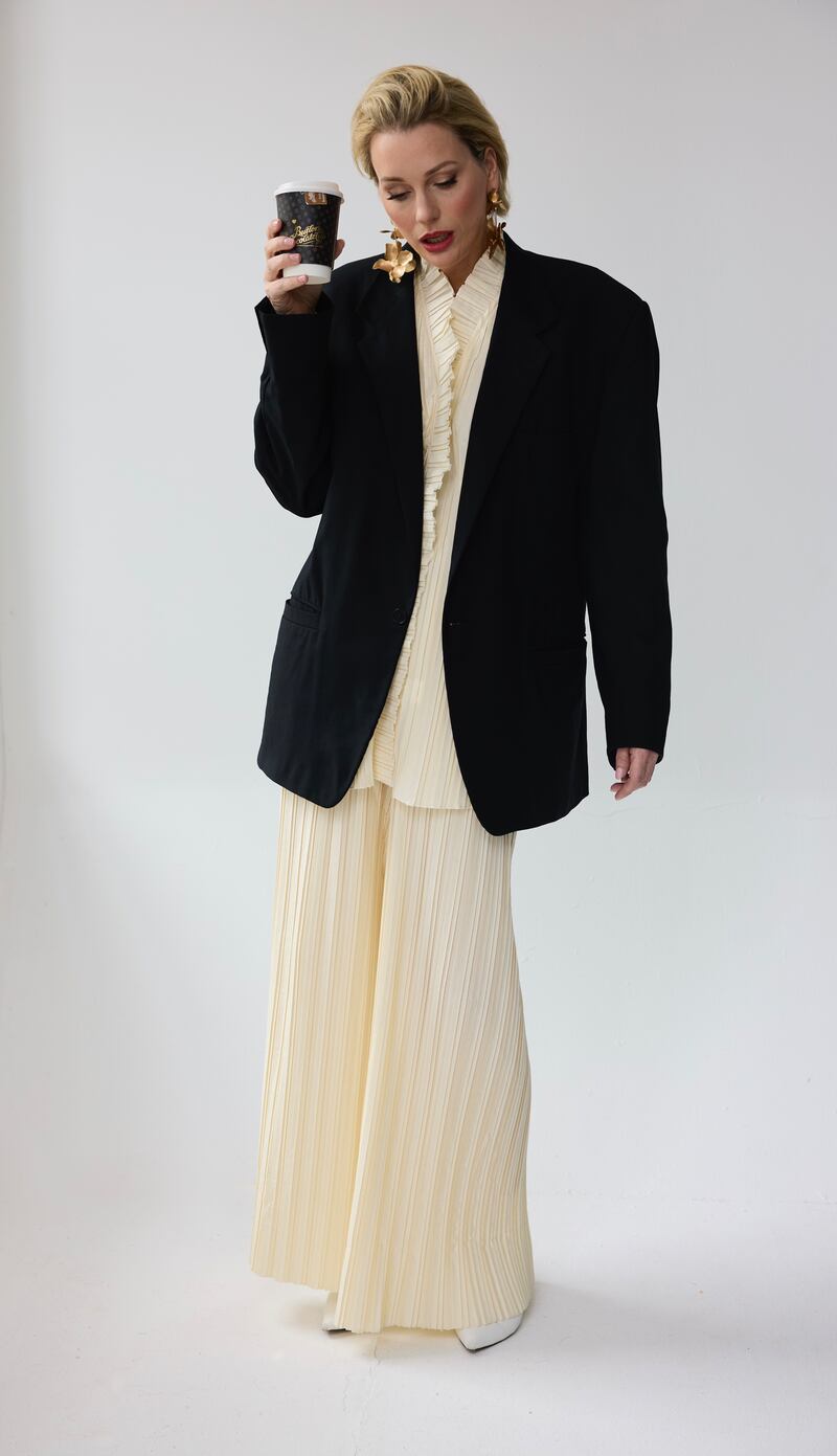 Miriam Cooke wears men's black suit jacket Armani €114, Vestiare Collective; beaded vintage gloves €25 @virtigovintage; pleated set by Touche Prive, €159.95, Zalando.ie; drop earrings €25 Asos Design. Photograph: Alan Keville