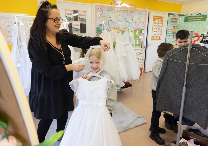 Fourth class pupil Annie Clifford at the Communion wear pop-up shop in Sacred Heart Primary School, Derry. Photograph: Joe Dunne