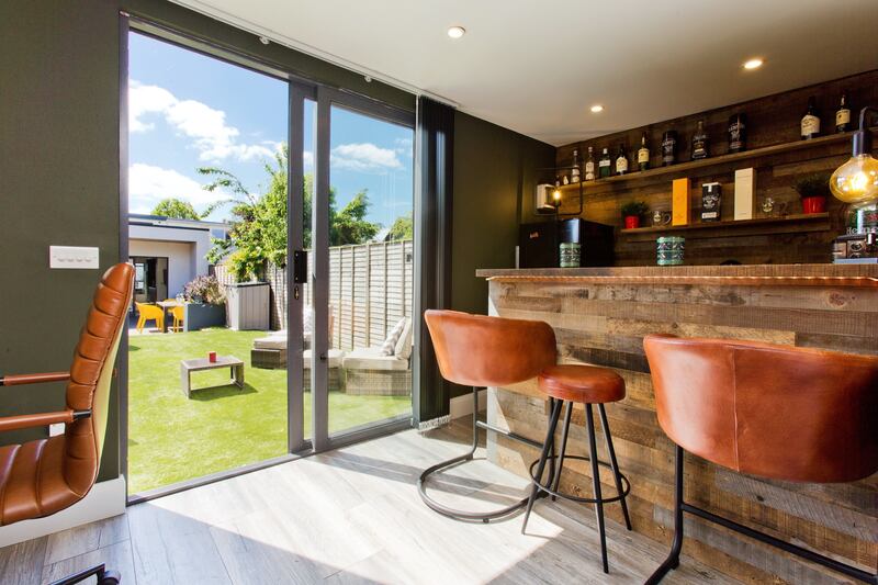 The garden room is an office/bar.