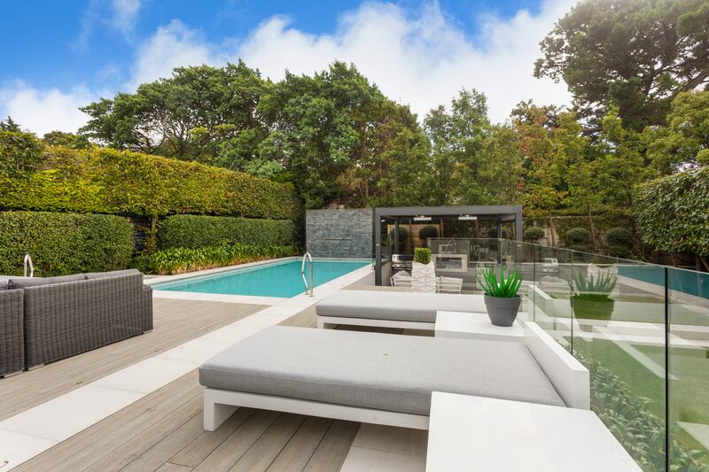 Back garden with swimming pool and decked seating area. Photograph: Alex Urdaneta