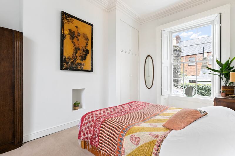 This bedroom enjoys plenty of natural light.