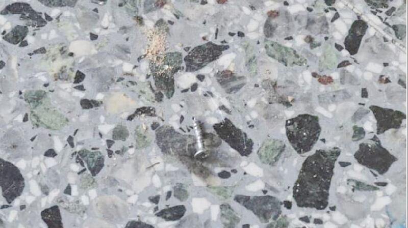 Screws propelled by the blast. The bomb’s makeshift shrapnel penetrated metal doors. Photograph: The New York Times