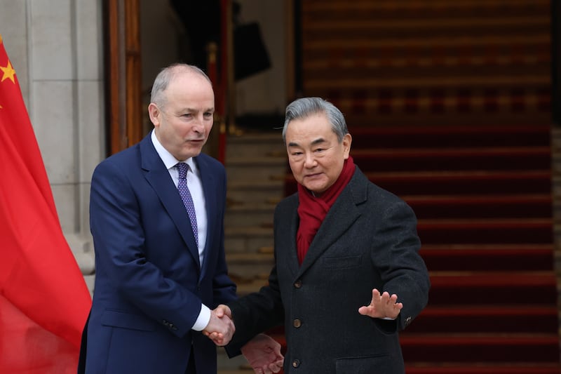 Taoiseach Micheál Martin with Chinese foreign minister Wang Yi  at Government Buildings in Dublin in February. Photograph: Stephen Collins/Collins Photos
