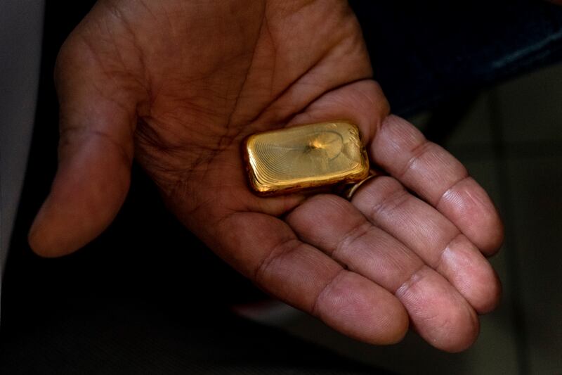 Eric Silva, a gold trader, displaying his wares in Boa Vista, Brazil. Photograph: Victor Moriyama/The New York Times
                      