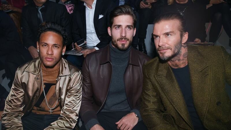 Neymar,  PSG goalkeeper Kevin Trapp and  David Beckham attend a fashion show in Paris on Thursday. Photograph:  EPA/STR