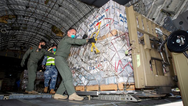 Air Movements Operators unloading humanitarian assistance and engineering equipment following the eruption of Tonga’s Hunga Tonga- Hunga Ha’apai underwater volcano on 15 January. Photograph: Commonwealth of Australia 2022, Department of Defence.