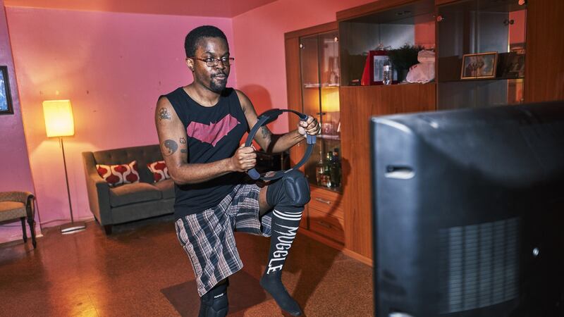 Tristan Scatliffe exercising with Ring Fit at his Brooklyn home. Ring Fit Adventure is the latest effort by the video game industry to try to entice consumers to get up off the couch and become more active. Photograph: An Rong Xu/The New York Times