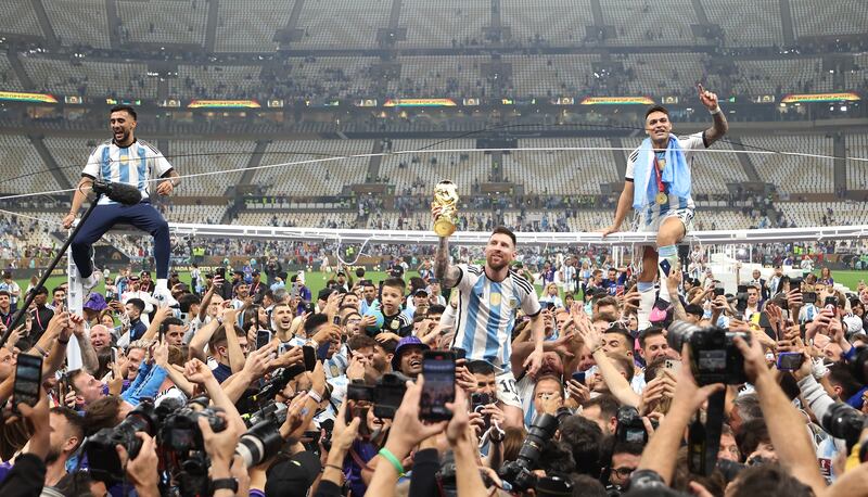 Lionel Messi of Argentina celebrates with the World Cup while on the shoulders of Sergio Aguero, with whom he roomed throughout the tournament. Photograph: by Lars Baron/Getty Images