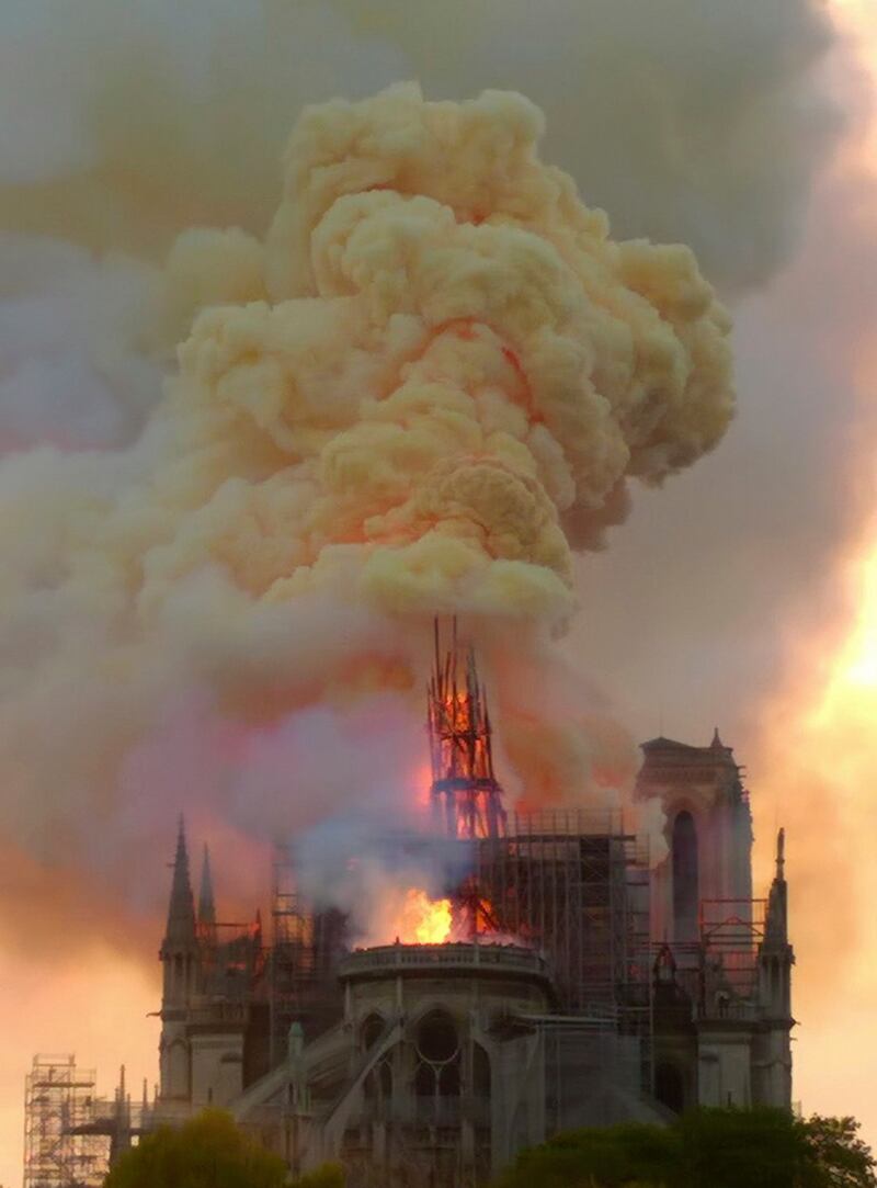 Flames and smoke rise as the spire of Notre Dame cathedral is on fire in Paris, Monday, April 15th, 2019. Photograph: Dominique Bichon/AP