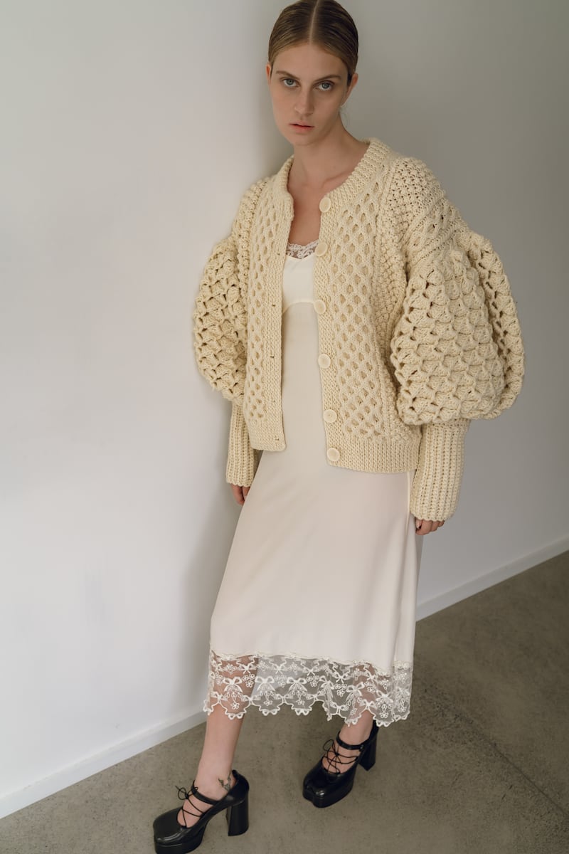 Handknit Aran sweater with puff sleeve detail in sand €1450, cream slip dress by Simone Rocha €455 at Havana Boutique. Photographer: Tetyana Maryshko