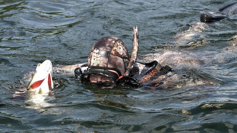 Putin in a diving suit enjoying spear-fishing during his vacation.