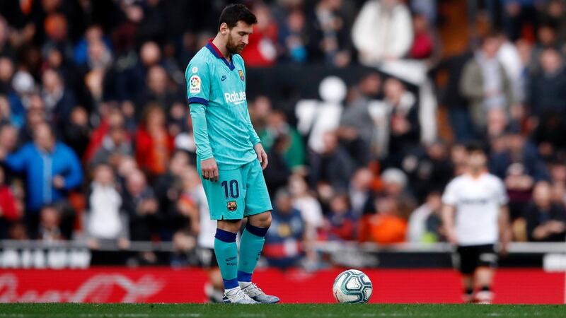 Lionel Messi looks dejected during Barcelona’s defeat to Valencia. Photograph:   Eric Alonso/Getty