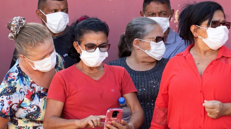 Relatives wait to enter the Legal Medical Institute to identify some of the bodies of the Altamira massacre. Photograph:  Joedson Alves/EPA