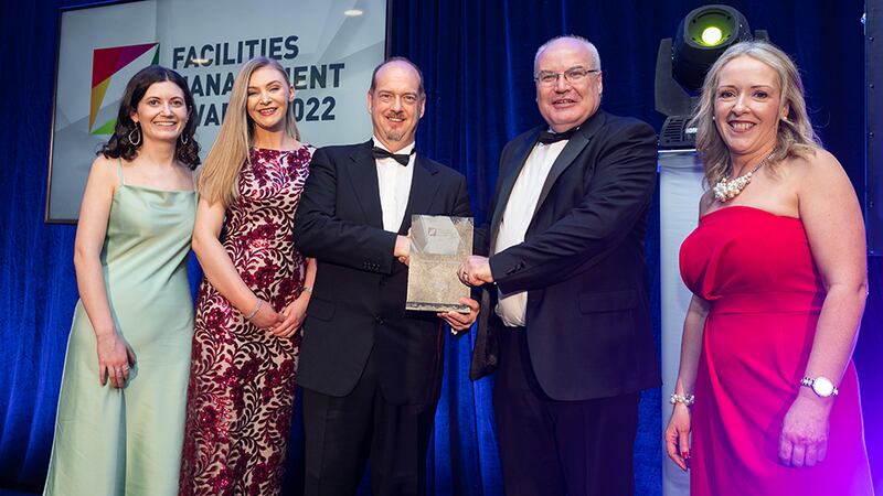 Bernard MacOscair, the Managing Director of Berka Solutions, and Denise Flood, the College Director of Portobello Institute, presents the Excellence in Sustainability Award to the An Post team.