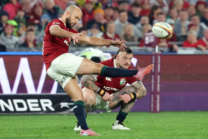 Jamison Gibson-Park kicks the ball as Andrew Porter looks on. Photograph: David Gray/AFP via Getty Images