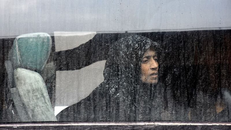 A Syrian civilian, who was evacuated from the Shiite villages of Fua and Kefraya, waits on a bus before heading to Homs in order to receive medical care. Photograph:  George Ourfalian/AFP/Getty Images