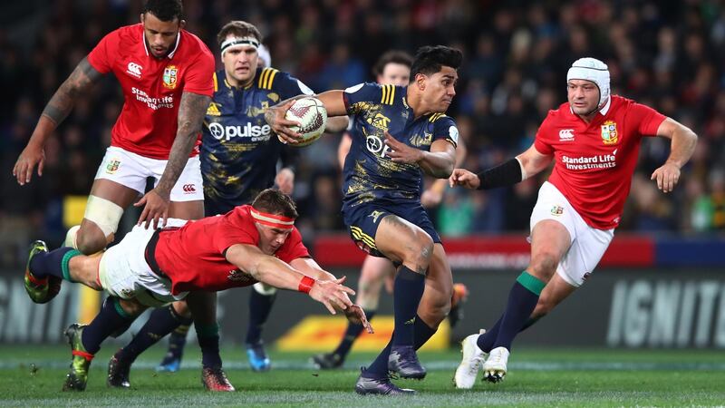 Malakai Fekitoa of the Highlanders splits the Lions defence . Photograph: Hannah Peters/Getty Images