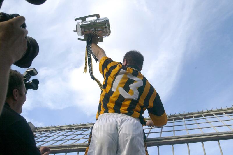 DJ Carey brings the cup to Kilkenny fans on Hill 16 following the 2003 All-Ireland hurling final victory over Cork, the run-up to which had featured fevered speculation about the hurler's private life. Photograph: Lorraine O'Sullivan/Inpho 