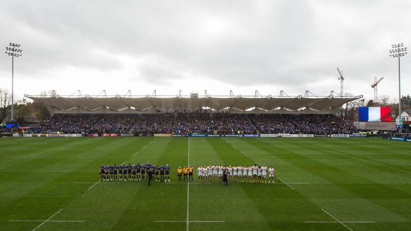 Both sets of teams observe a minute’s silence in respect of the weekend’s tragedy in France. Photograph: Ryan Byrne/Inpho