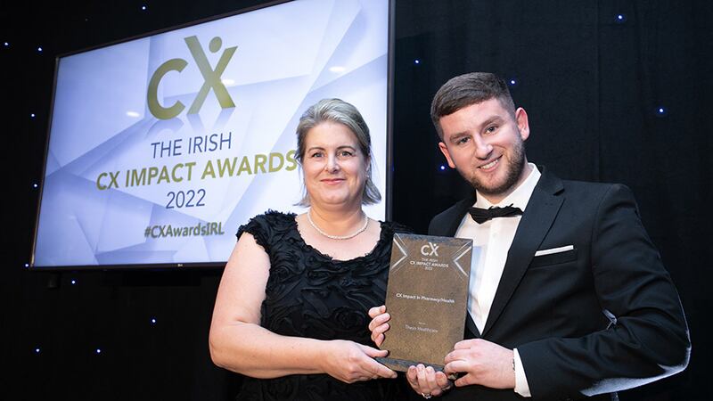 Maria Svejdar, awards judge, presents the CX Impact in Pharmacy/Health award to Adam Kane, BusinessRiver, on behalf of Theya Healthcare.