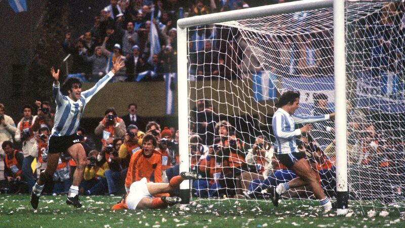 Argentinian midfielder Mario Kempes celebrates in front of forward Daniel Bertoni and Dutch defenders Wim Suurbier (on ground) and Ruud Krol on June 25th, 1978, in Buenos Aires. Photograph: Staff/ AFP/Getty Images