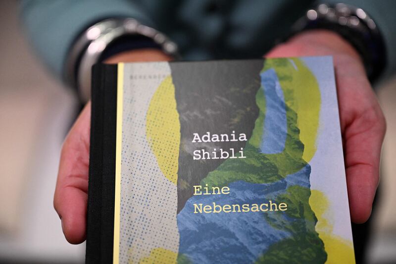 The German edition of the book by Palestinian author Adania Shibli with the title Minor Detail. The postponement of a Palestinian author's award ceremony at the Frankfurt Book Fair due to the Israel-Hamas war triggered condemnation from high-profile authors including Colm Tóibín. Photograph: Kirill Kudryavtsev/AFP via Getty Images