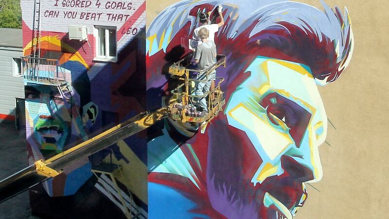 A mural of Argentina’s Lionel Messi is painted next to a portrait of Portugal’s Cristiano Ronaldo in Kazan. Photograph: Alexey Nasyrov/Reuters