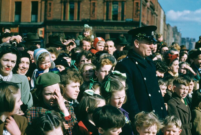 A crowd watching a St Patrick’s Day street parade in Dublin,  June 1955. Photo by Bert Hardy/Picture Post/Hulton Archive/Getty Images