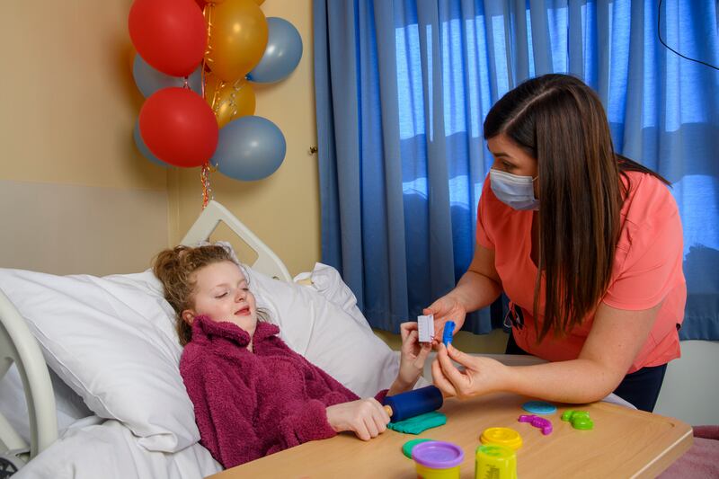 Children’s Ward patient Áine Ducey with play specialist Rachel Griffin at Cork University Hospital. Photograph: Daragh Mc Sweeney/Provision
