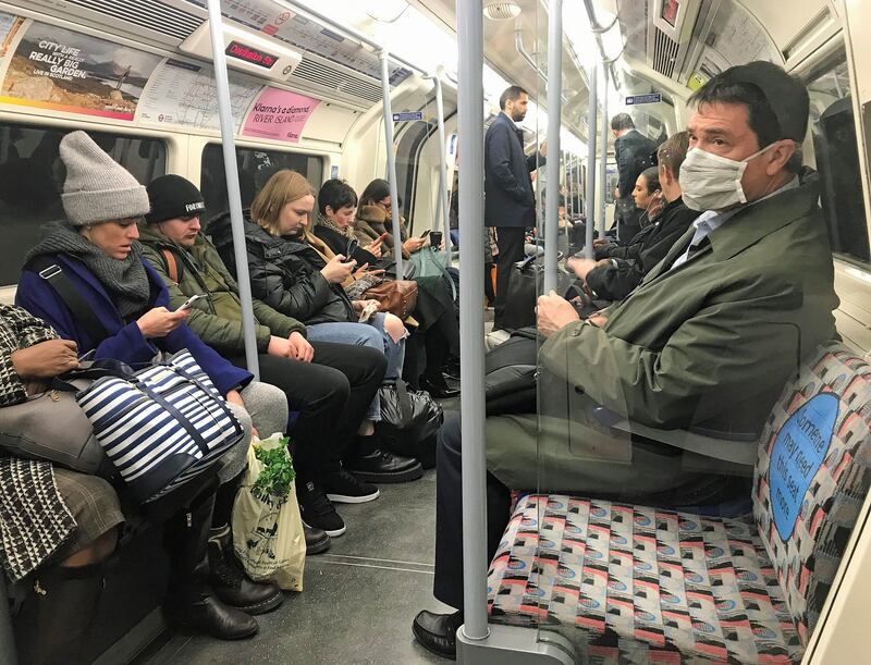 A man on the Jubilee line of the London Underground tube network wearing a protective facemask on the day that UK heath secretary Matt Hancock said that the number of people diagnosed with coronavirus in the UK has risen to 51. Photograph: Kirsty O’Connor/ PA Wire